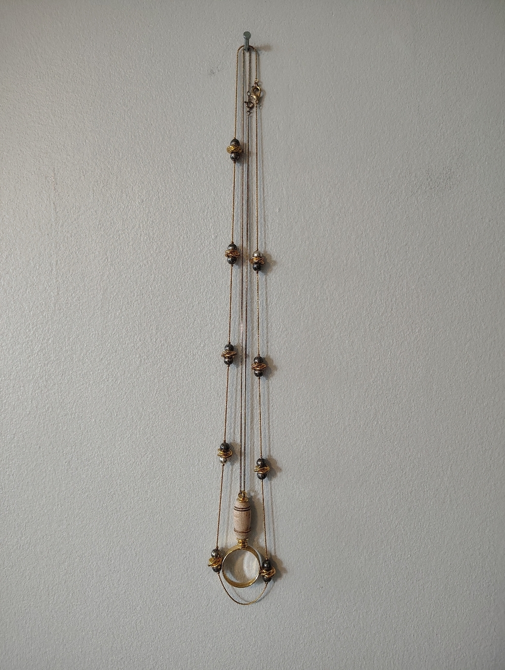 Two Necklaces, Gold coloured Magnify Glass